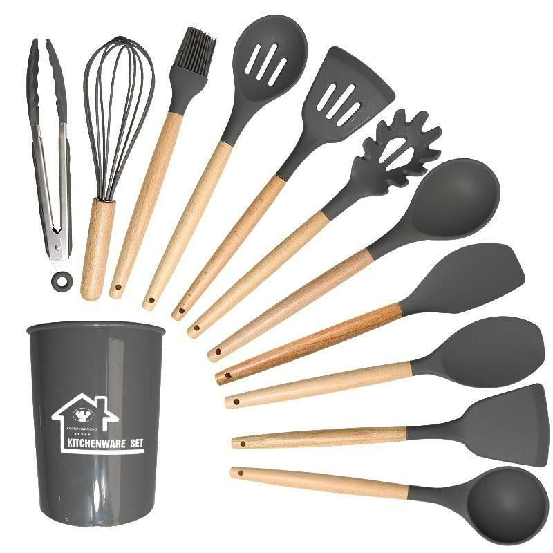 Set of kitchen utensils with wooden handles and a gray container on a white background