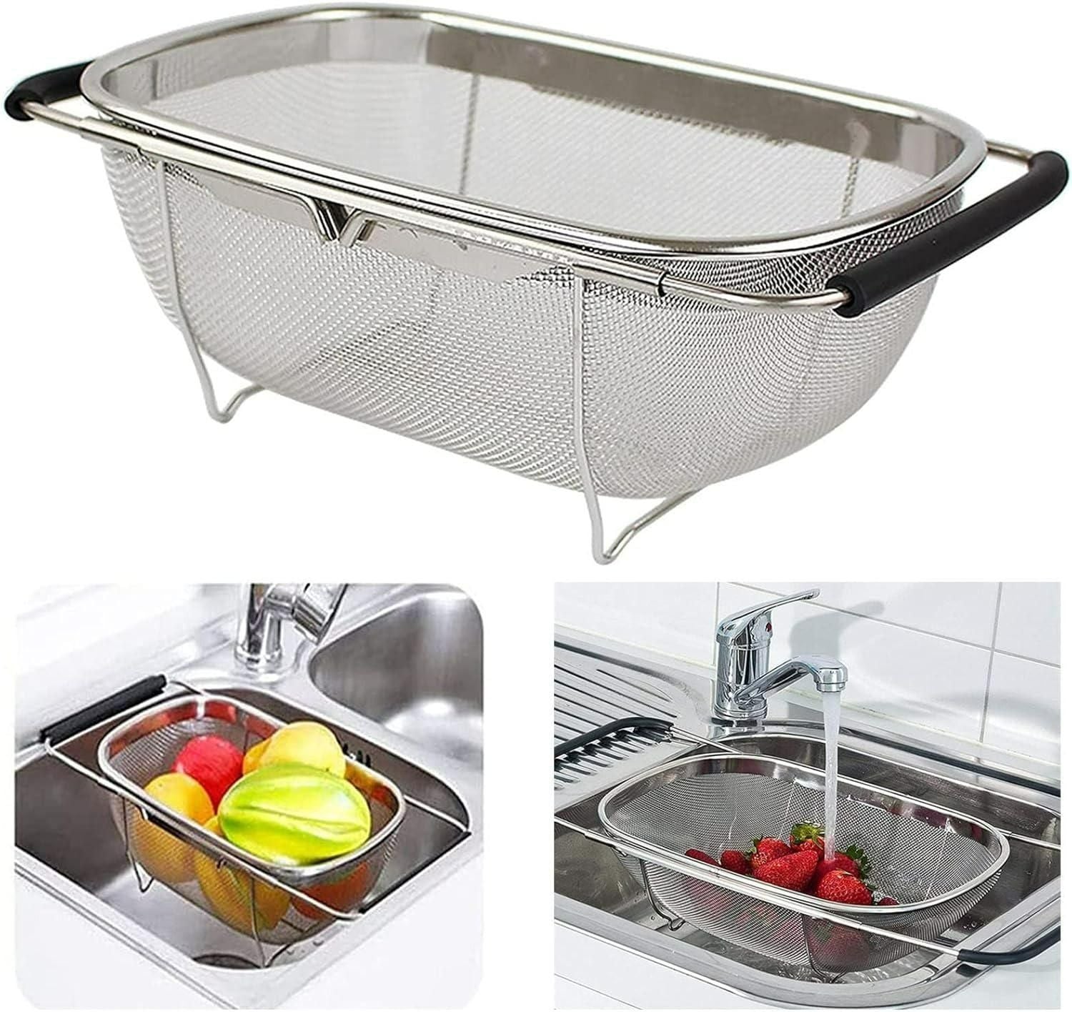Stainless steel colander with mesh design and black handle, used for washing fruits and vegetables.