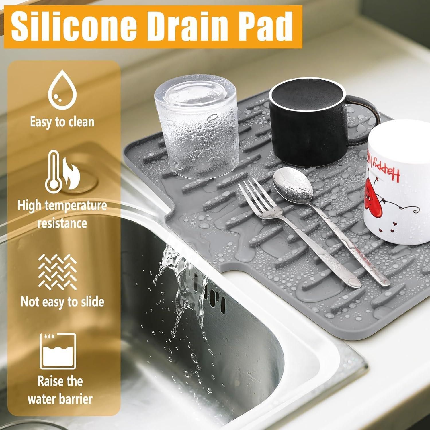 Silicone drain pad on a kitchen sink with utensils and a mug, featuring text on its benefits.
